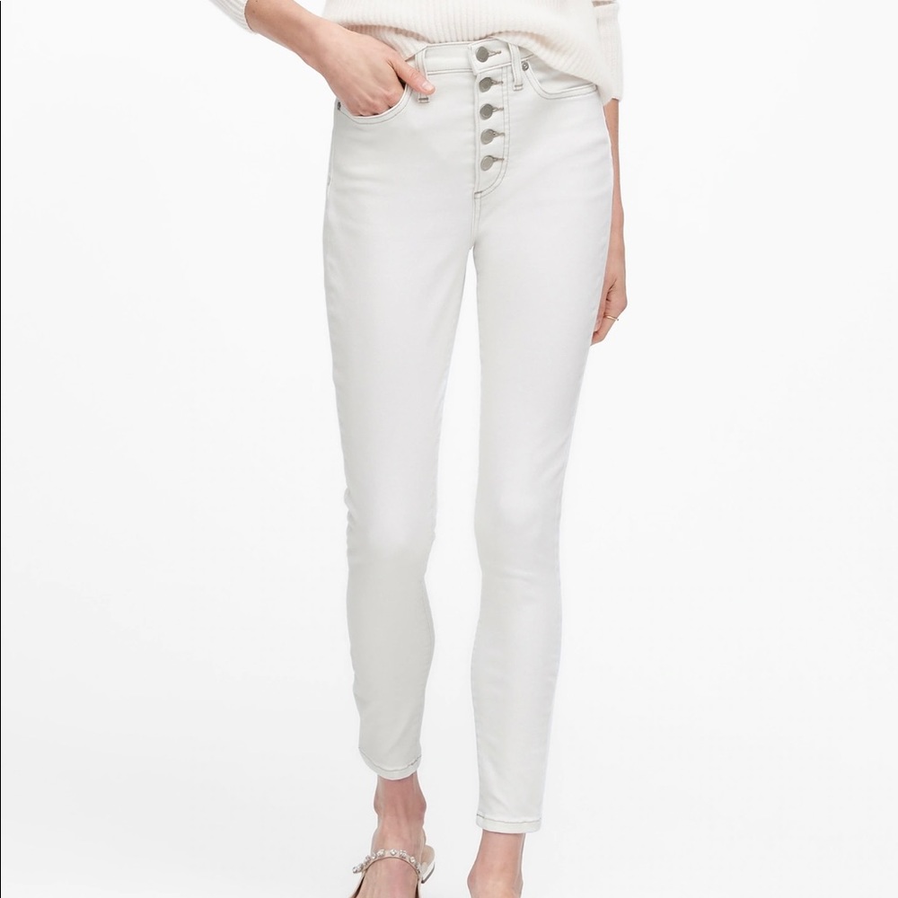 white skinny jeans with multiple buttons